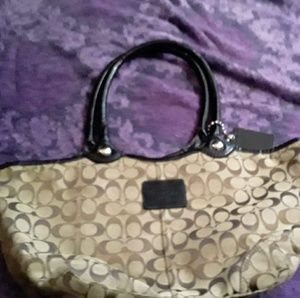 Coach purse with black trim